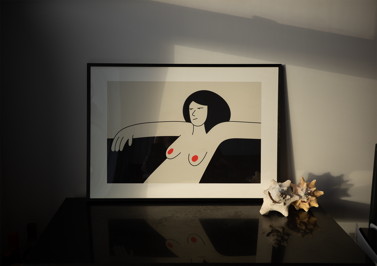 Picture of a framed illustration of a woman comfortably laid back.